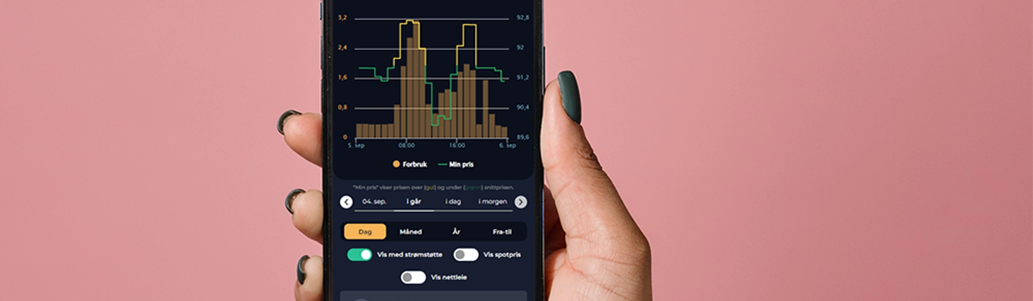 Bilde av en hånd som holder en mobiltelefon med GE-appen 